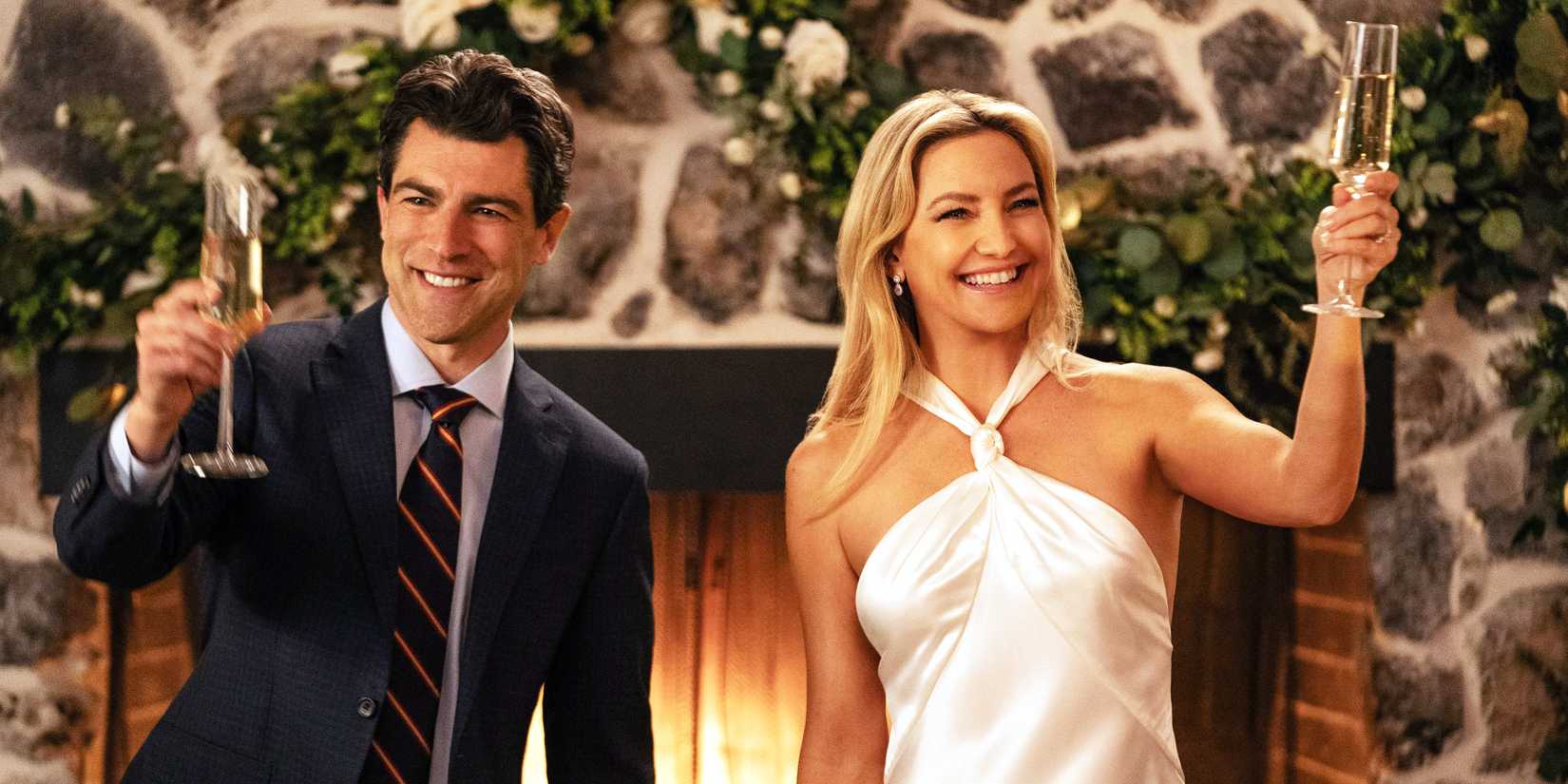 Max Greenfield and Kate Hudson raising glasses in a toast for Running Point