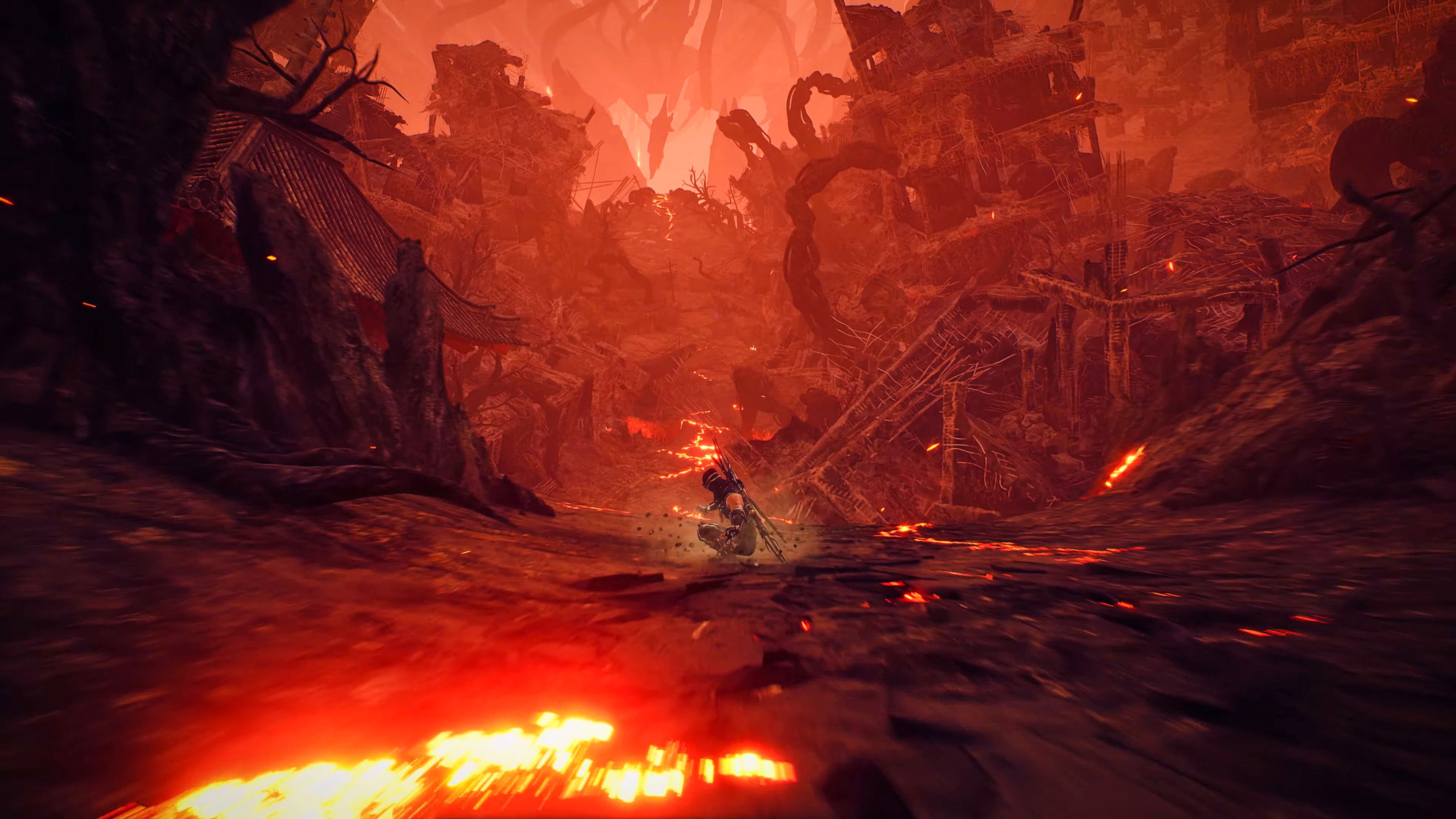 Ryu slides down a hill amid volcanic ruins in Ninja Gaiden 2 Black.
