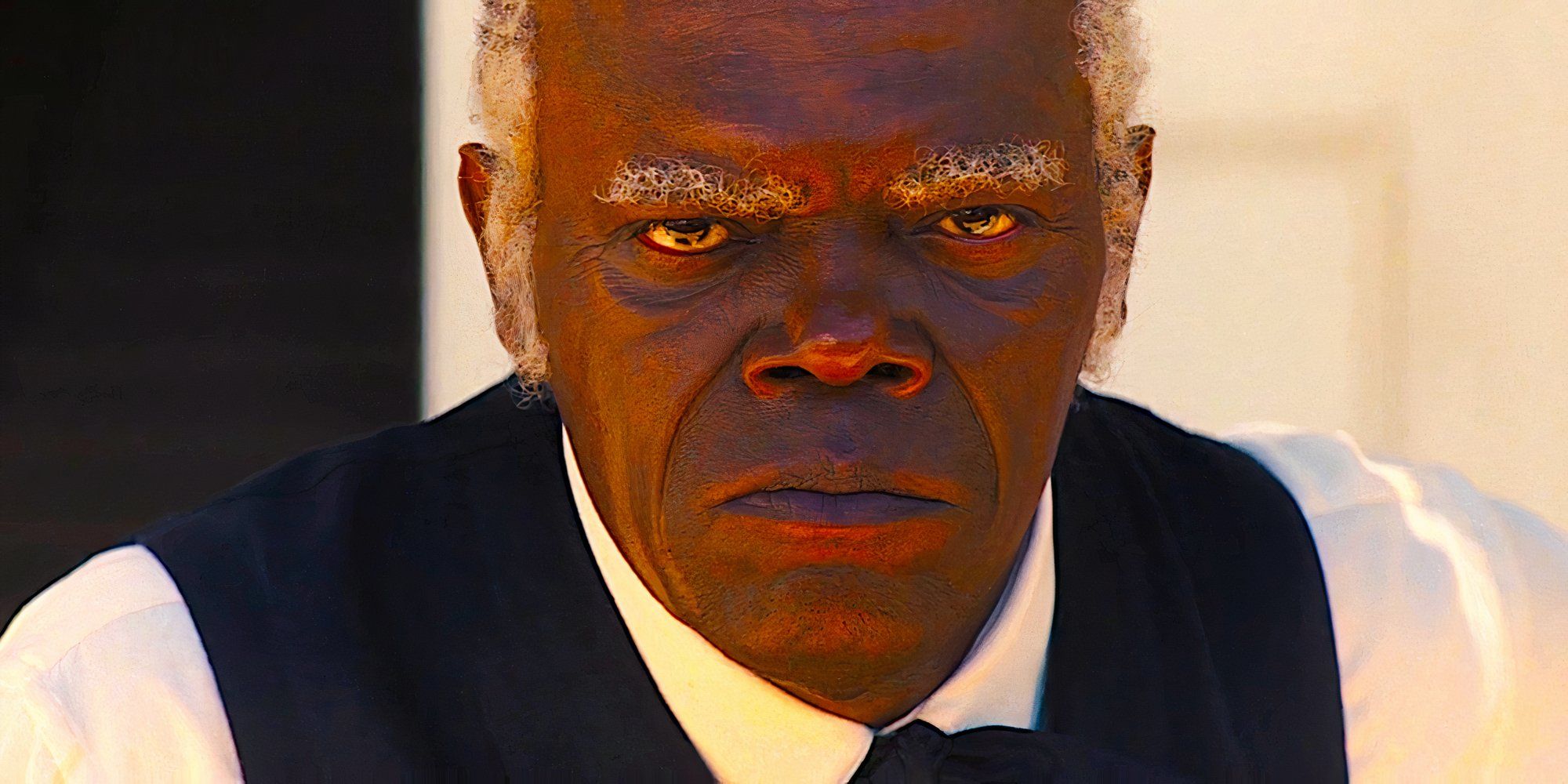 Stephen stares hatefully into the camera in a scene from Django Unchained.