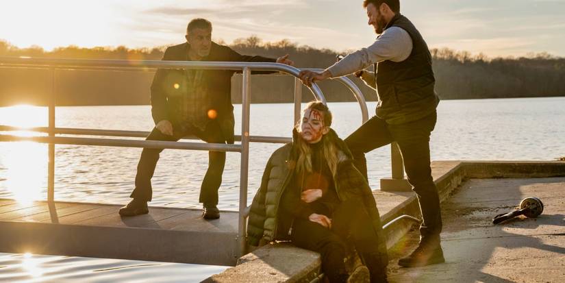 Scott Eastwood, Sylvester Stallone and Willa Fitzgerald on a dock in Alarum