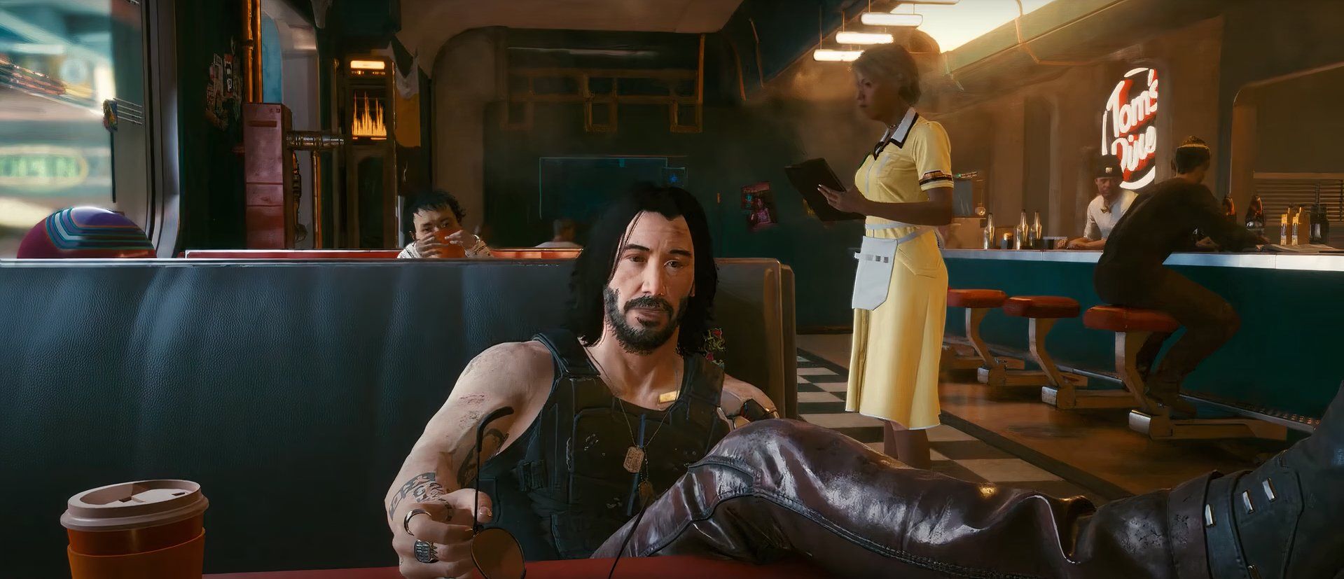Johnny Silverhand in Cyberpunk 2077 sitting in a diner
