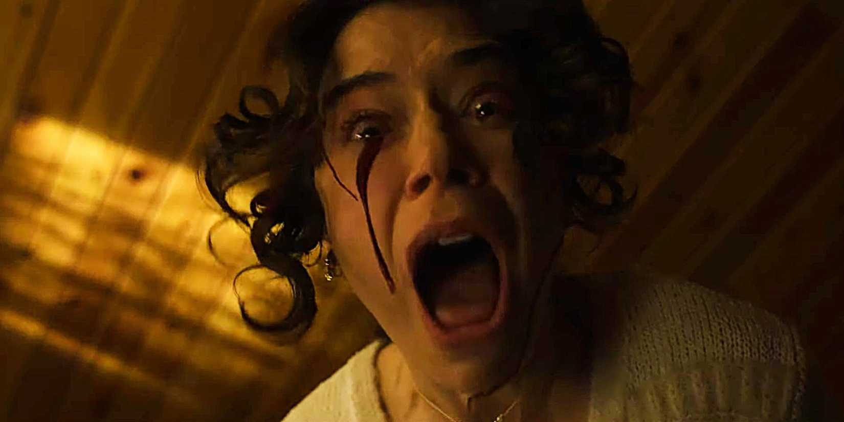 Tatiana Maslany screaming with blood running down her face in The Monkey