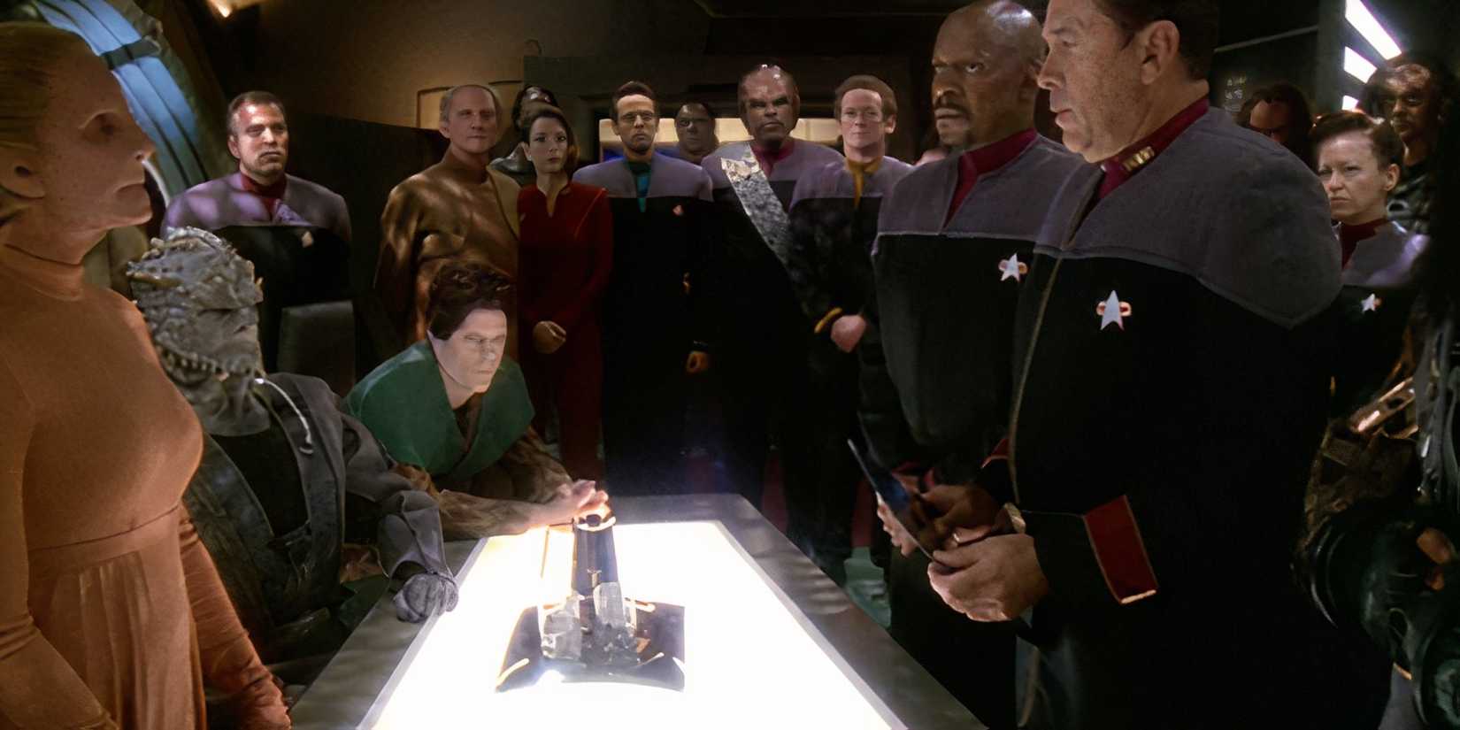 The Dominion and Federation representatives stand across the table from each other in DS9 what you leave behind finale