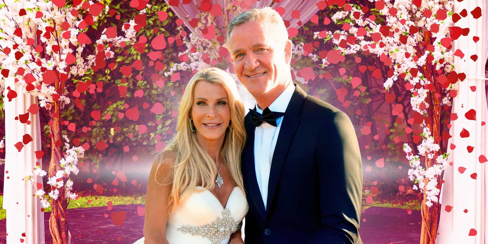 the golden bachelorette stars joan vassos and chock chapple in wedding outfits with rose petal background