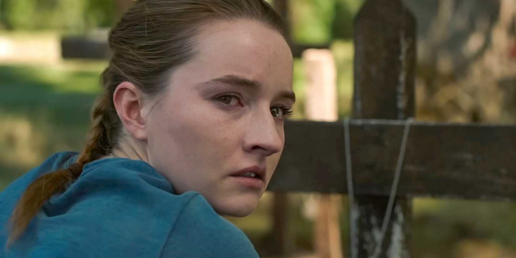 Abby Anderson (Kaitlyn Dever) kneeling in front of a grave in The Last of Us Season 2 