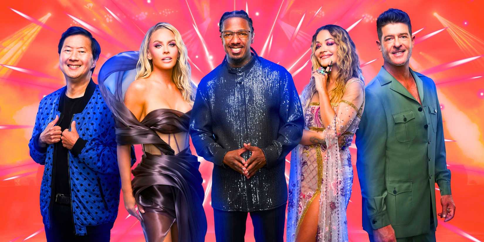 The Masked Singer's Ken Jeong, Jenny McCarthy, Nick Cannon, Rita Ora and Robin Thicke posing for the camera.