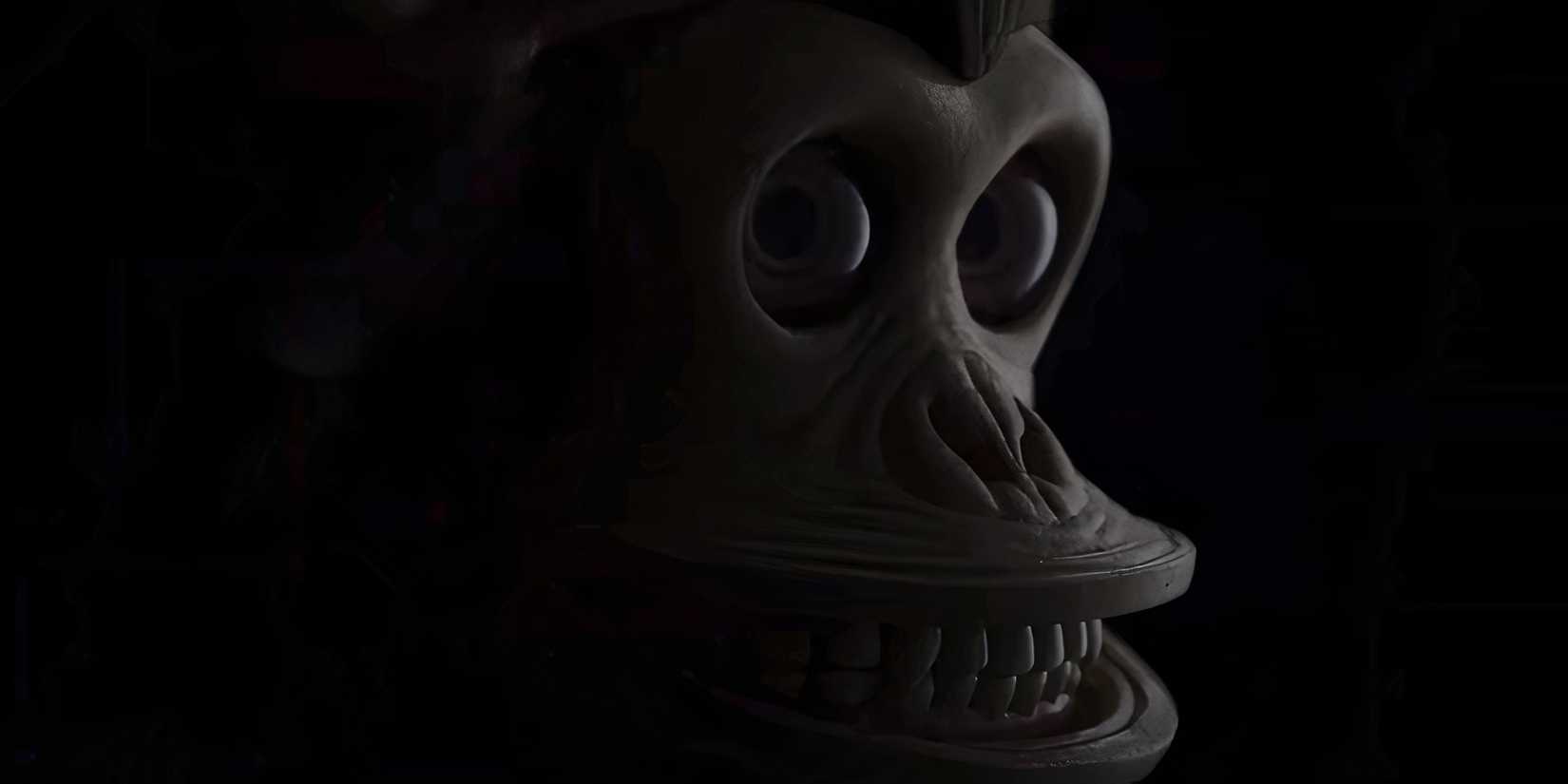 The Monkey toy smiling in The Monkey