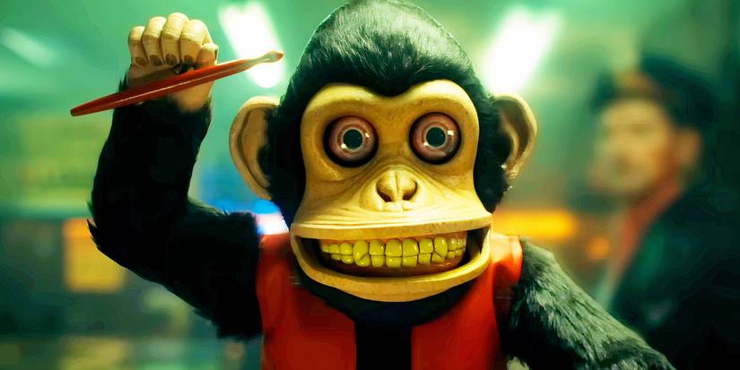 The monkey with one drumstick raised in The Monkey 2025