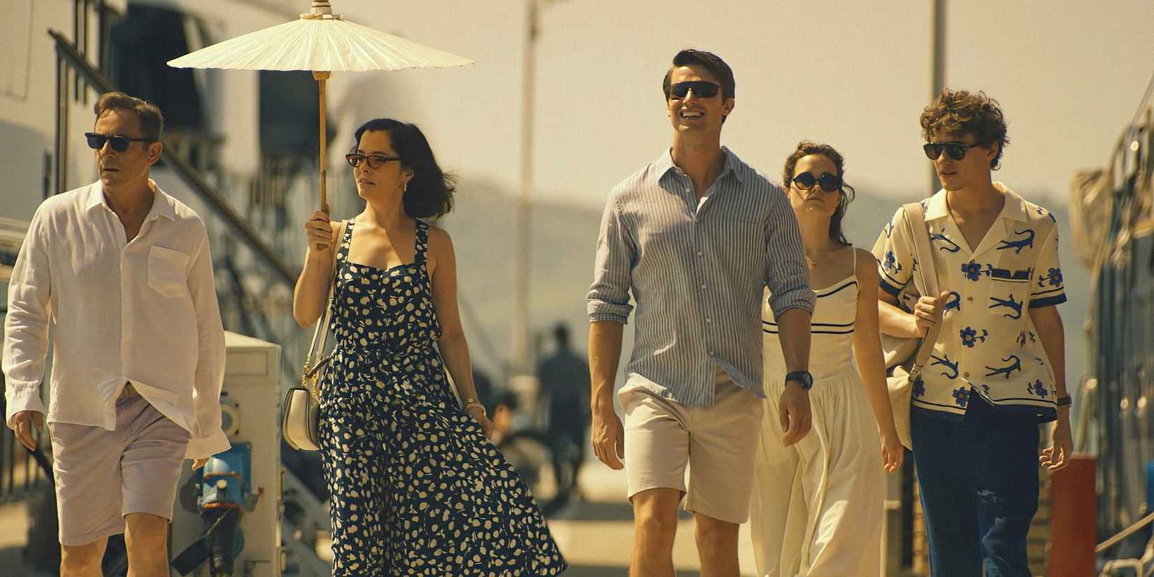 Characters smiling and walking outside in The White Lotus season 3