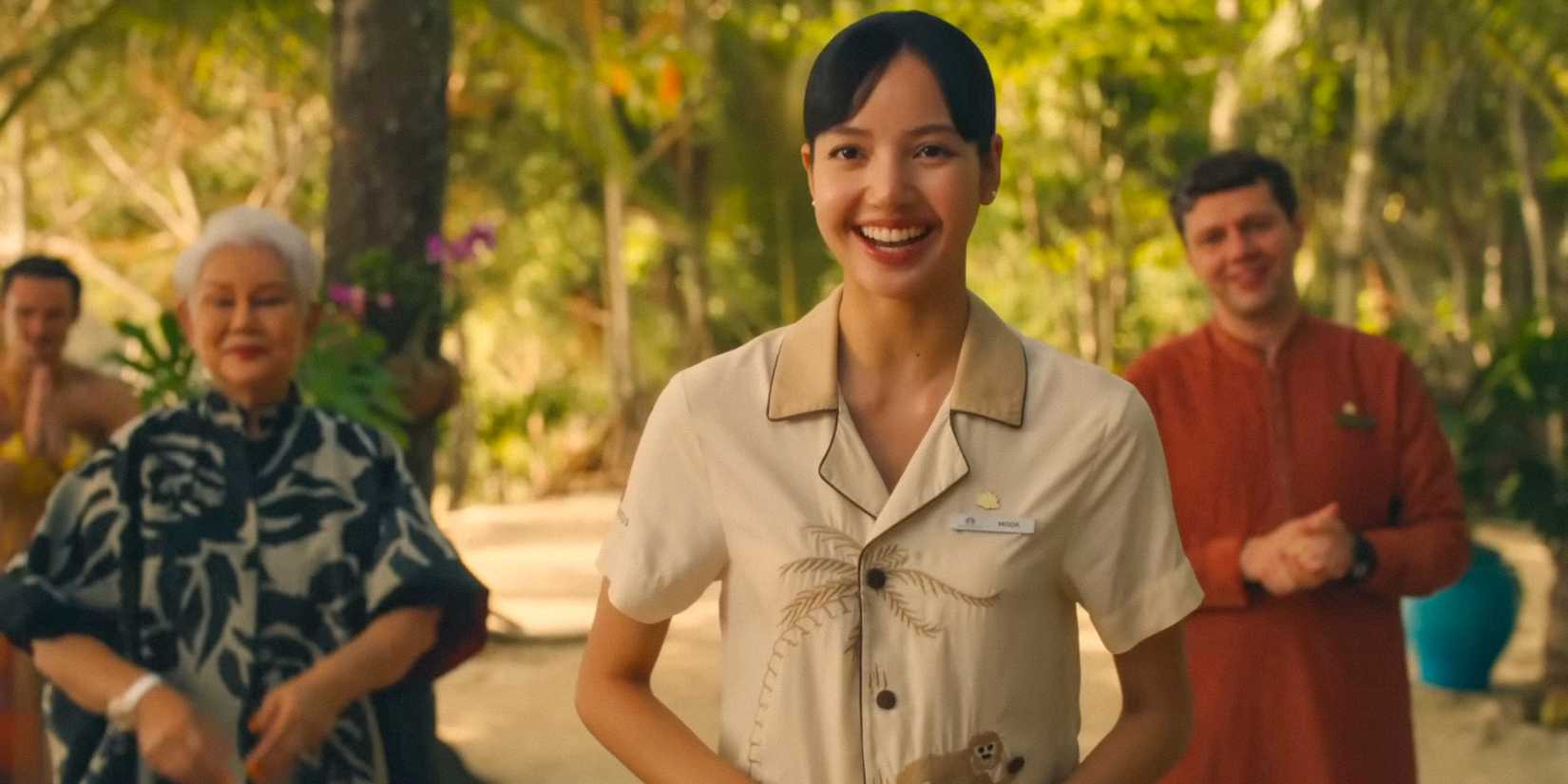 Lisa smiling and greeting guests in The White Lotus season 3