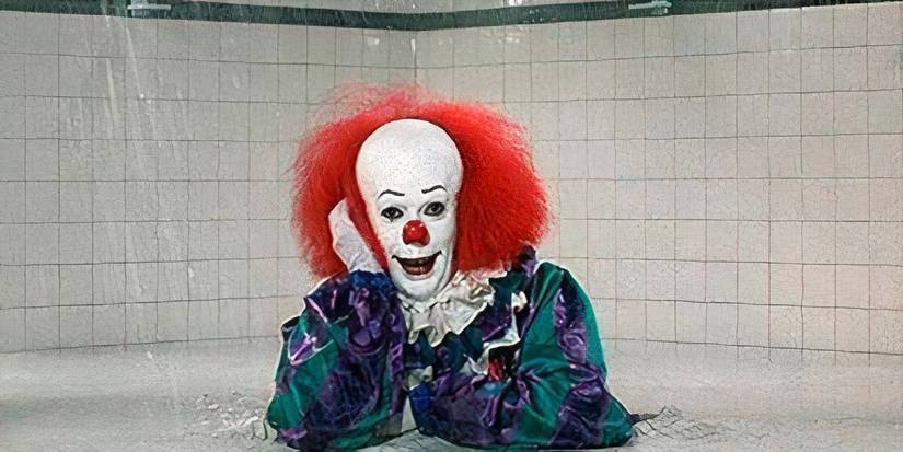 Tim Curry As Pennywise rising out of a drain In the IT Miniseries