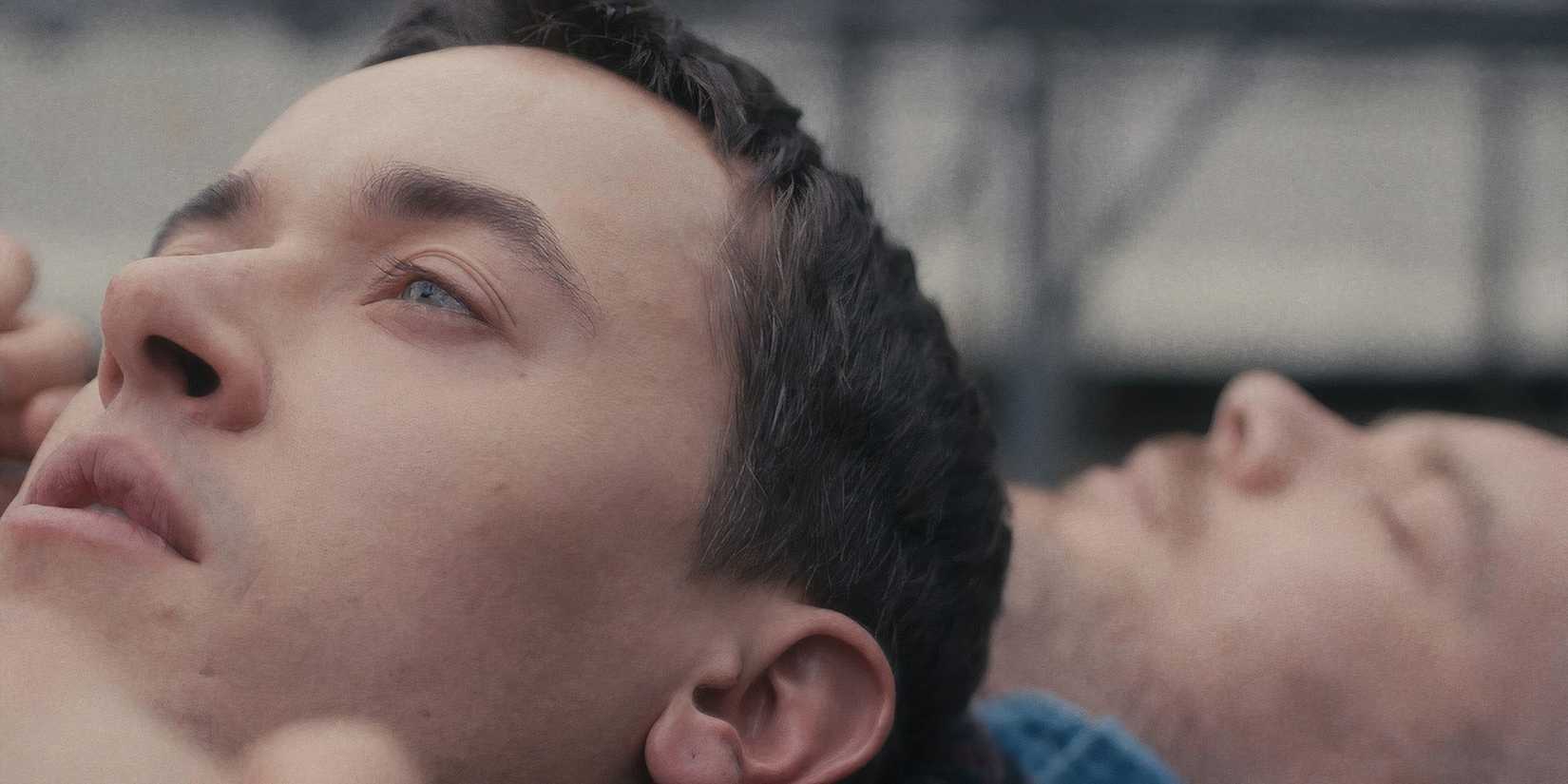 Tom Blyth and Russell Tovey lying down in Plainclothes