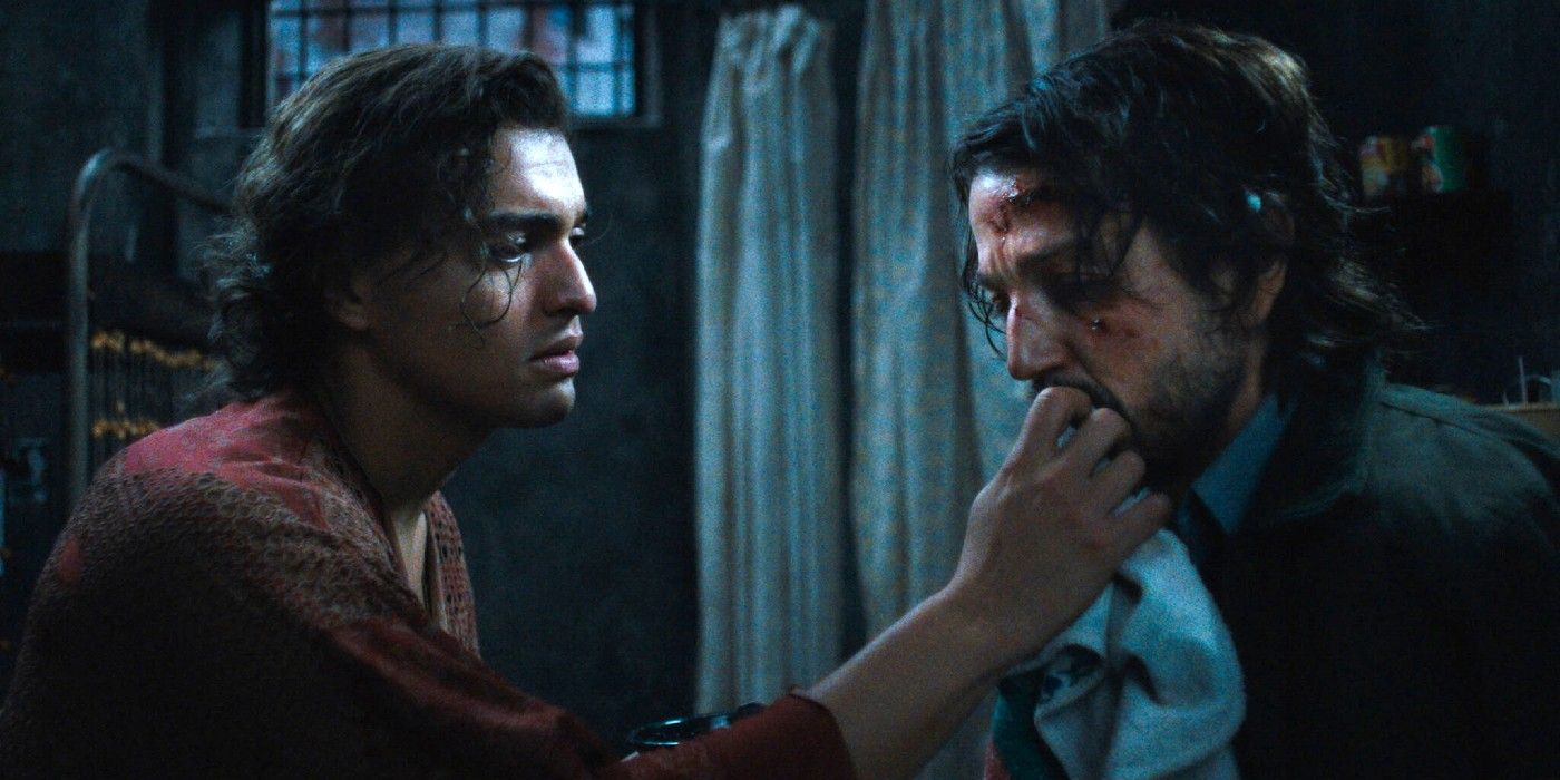 Tonatiuh feeds Diego Luna an apple in Kiss of the Spider Woman