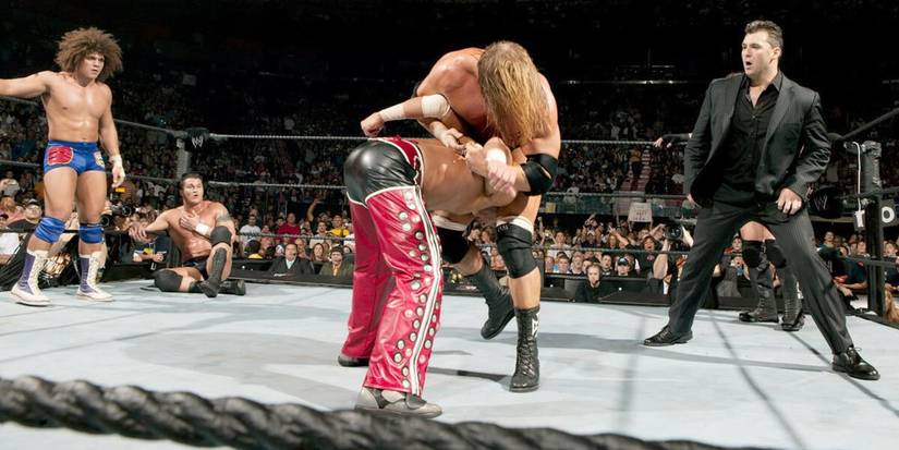 Triple H tries to hit a Pedigree on Shawn Michaels at WWE Royal Rumble 2006 in front of Shane McMahon Randy Orton and Carlito (1)