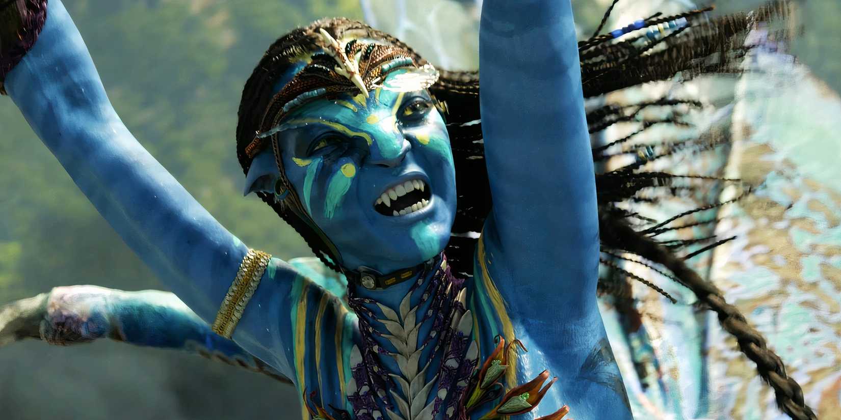 Neytiri with her arms up and smiling in Avatar: The Way of Water
