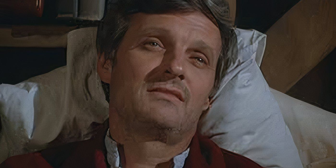 A sick Alan Alda as Hawkeye lying in bed in the MASH episode "Bless You Hawkeye."