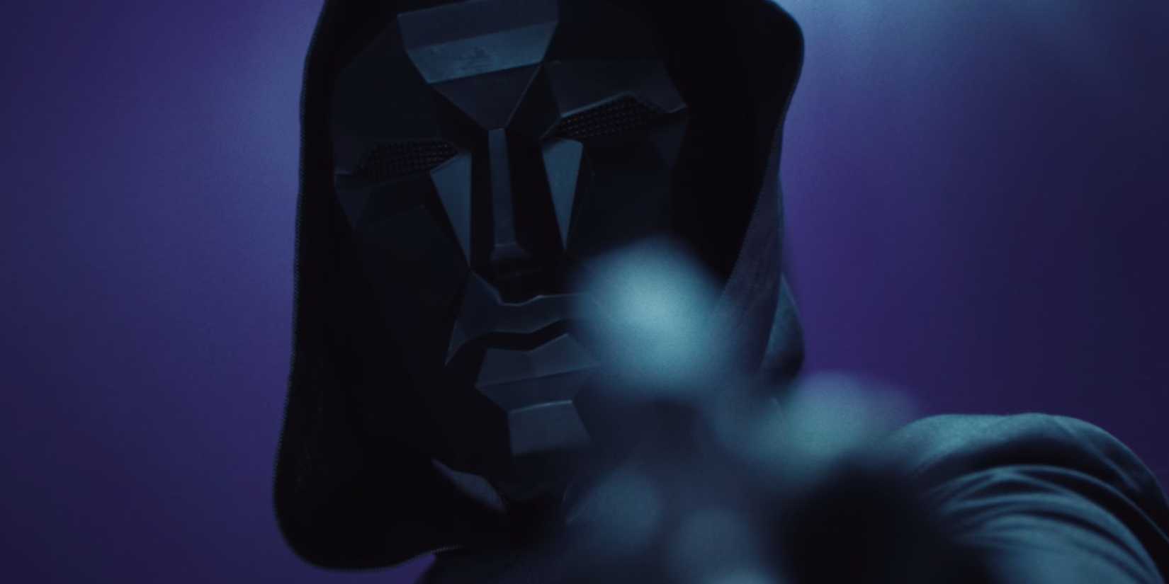The Front Man aiming a gun at the screen in Squid Game