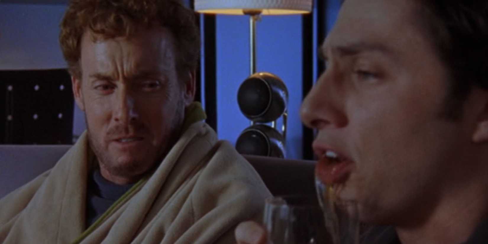 Dr. Cox looking in disgust at JD spitting out scotch in Scrubs