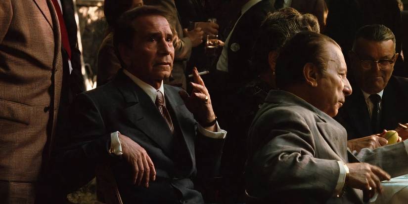 Richard Conte as Barzini smoking in The Godfather