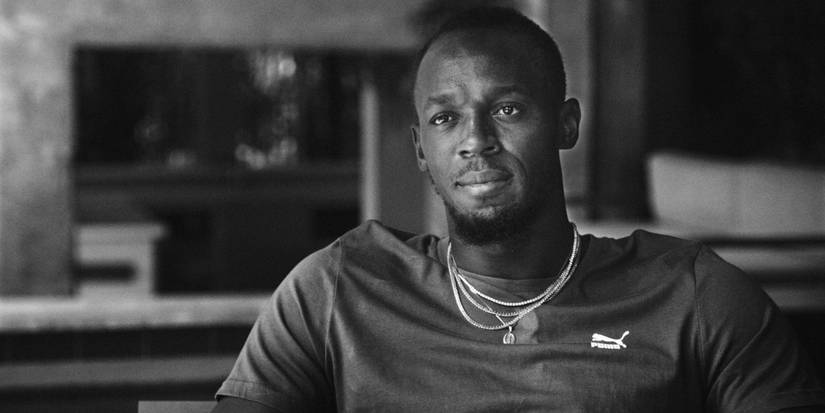 Usain Bolt sitting down for an interview in Greatness Code.