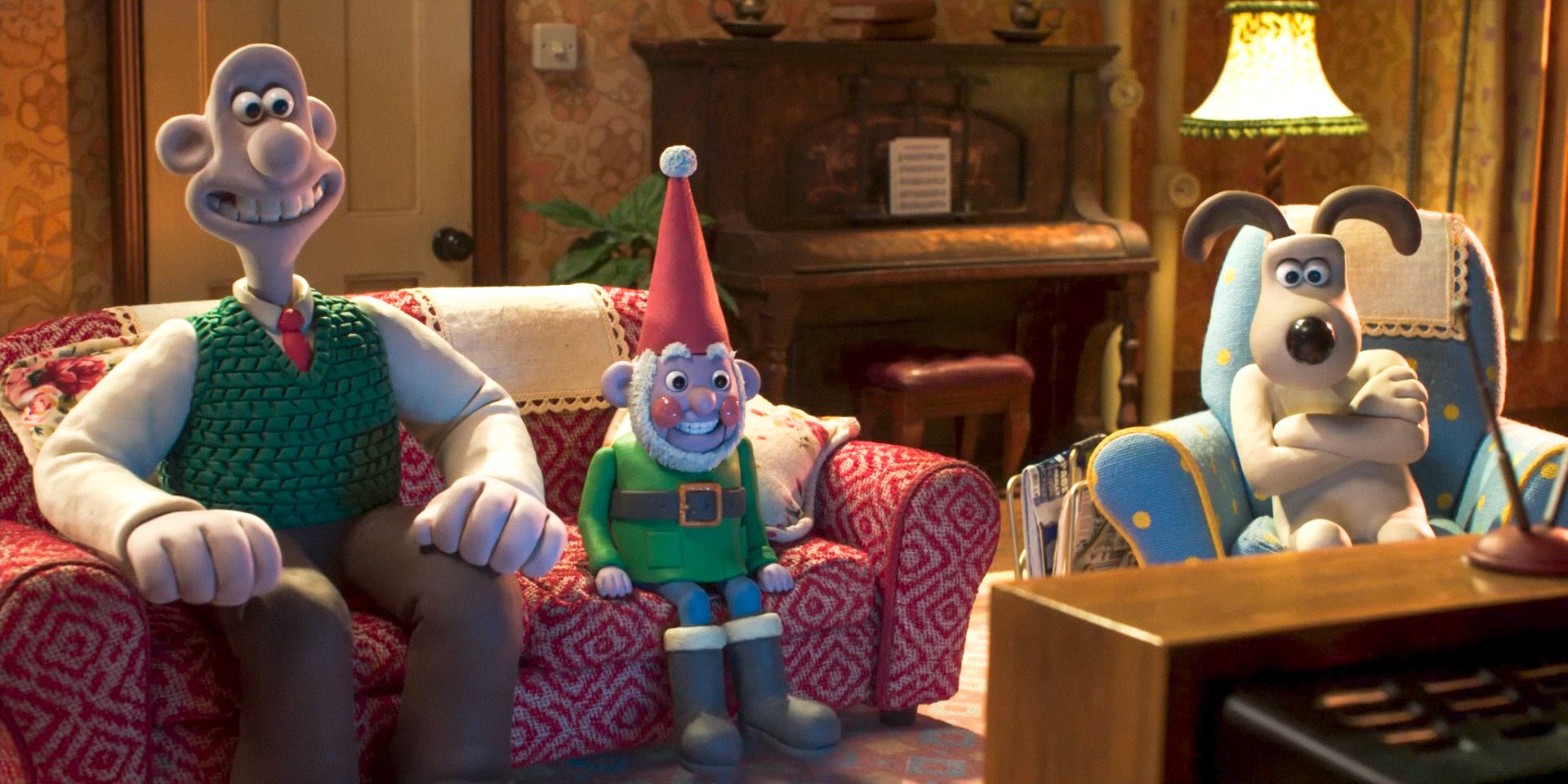 Wallace, Norbot and Gromit watching TV in Wallace &amp; Gromit: Vengeance Most Fowl