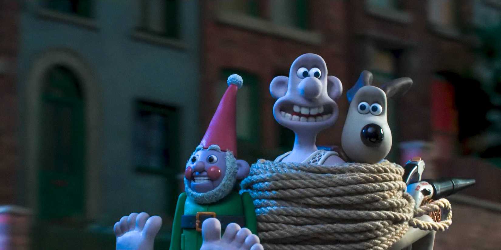 Norbot, Wallace, and Gromit, tied to chairs, chase after Feathers McGraw in Wallace & Gromit: Vengeance Most Fowl