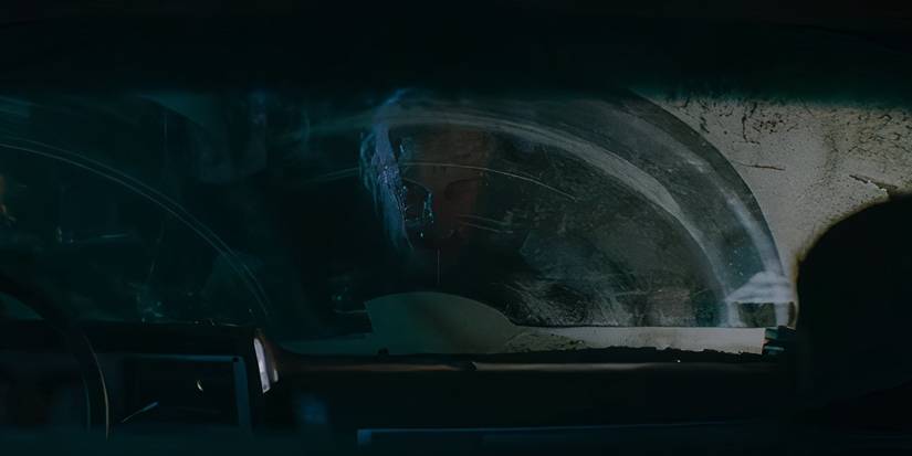 A werewolf looking through a car windshield in Wolf Man