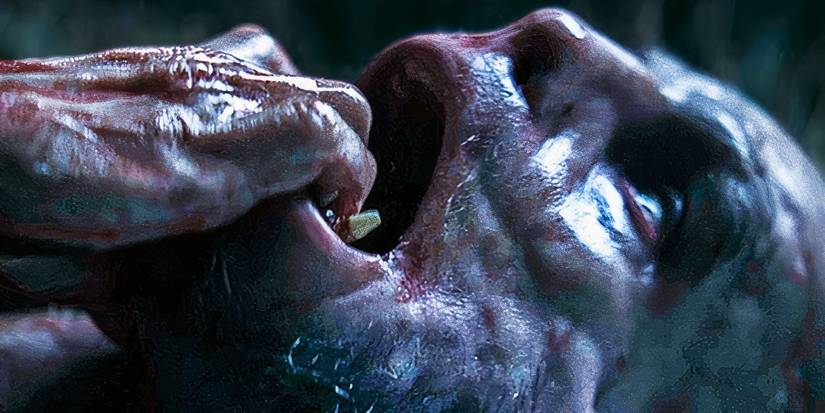 The Wolf Man grabs his teeth as he transforms