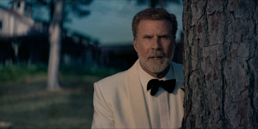 Jim (Will Ferrell) behind a tree in You're Cordially Invited.