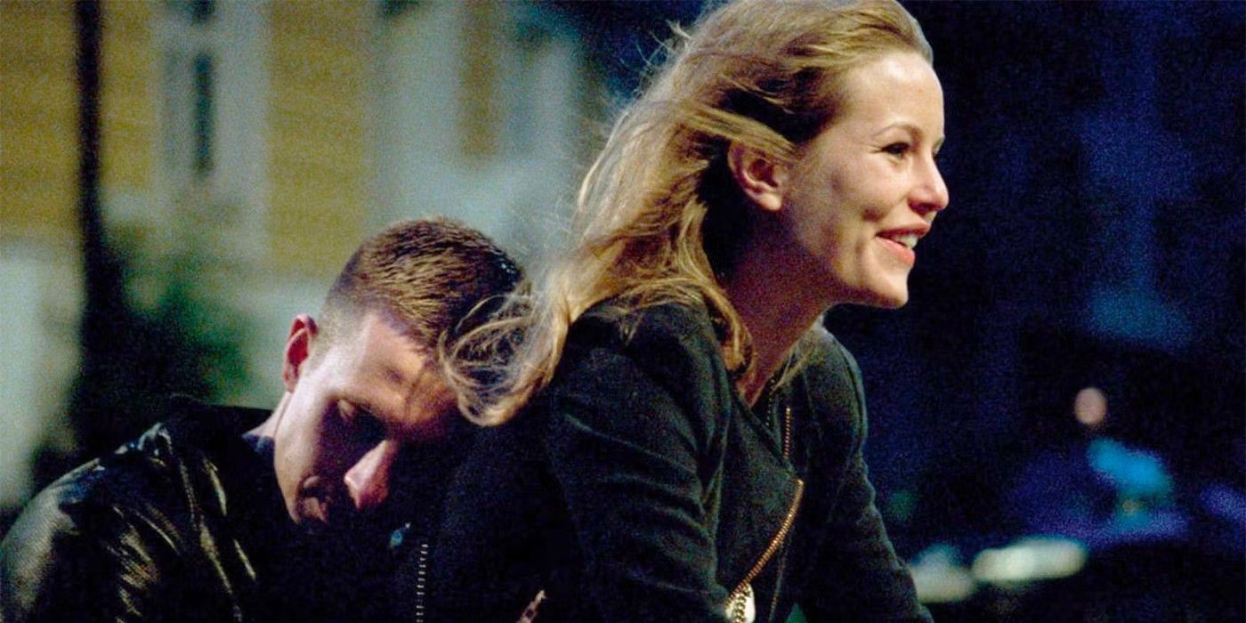 A man hugging a woman on a bicycle at night in Oslo, August 31