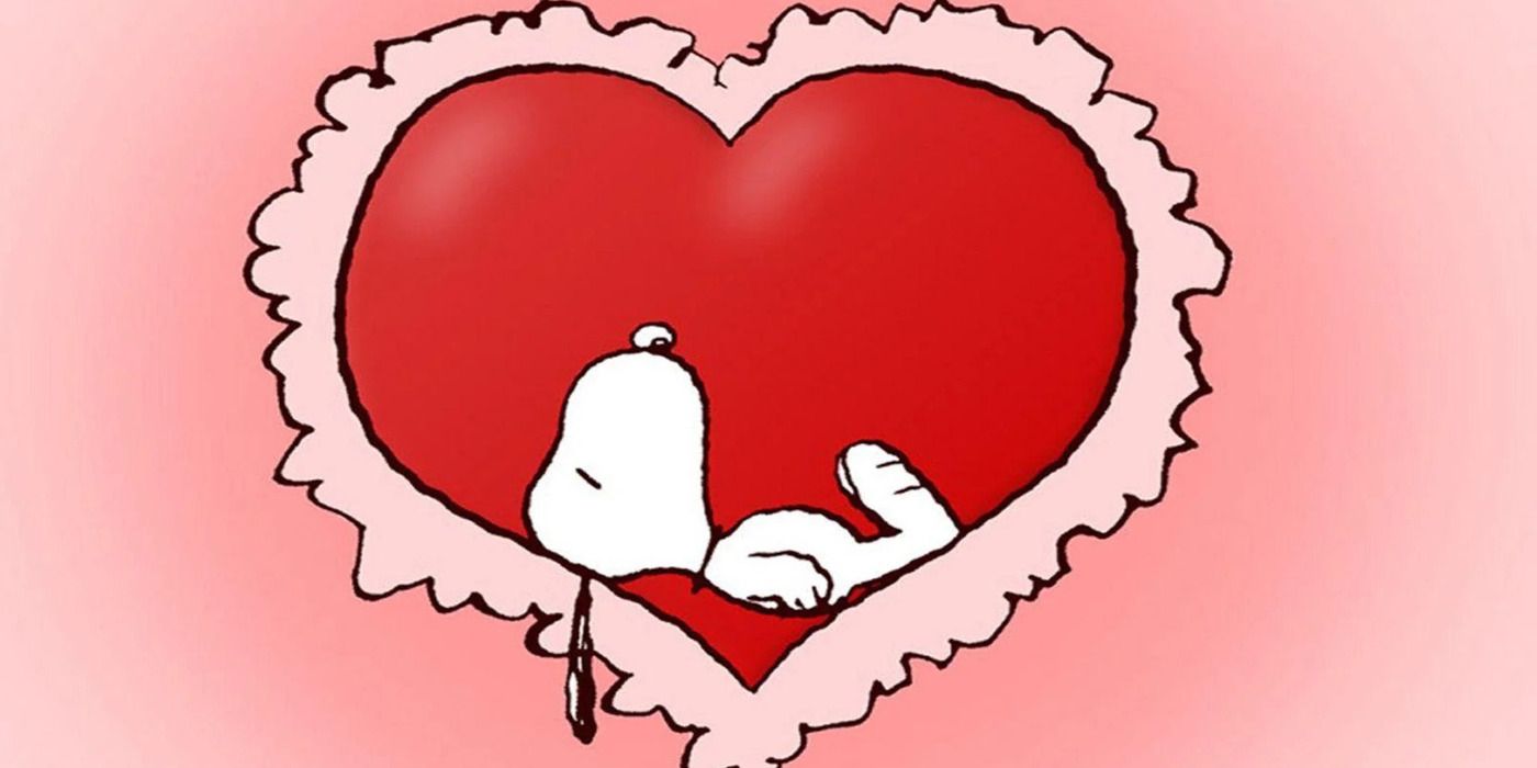 Snoopy in  a heart with a pink background.