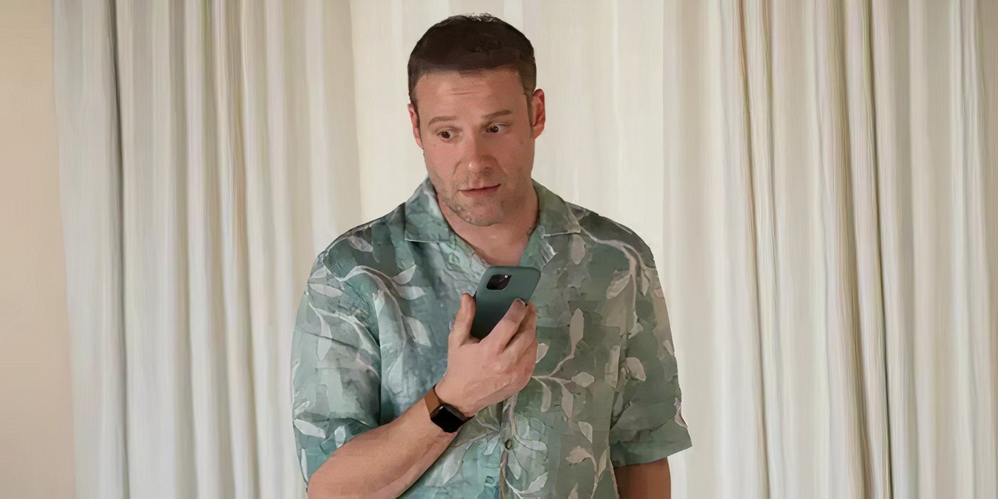 Gabe Plotkin (Rogen) looks stressed as he answers a phone call.