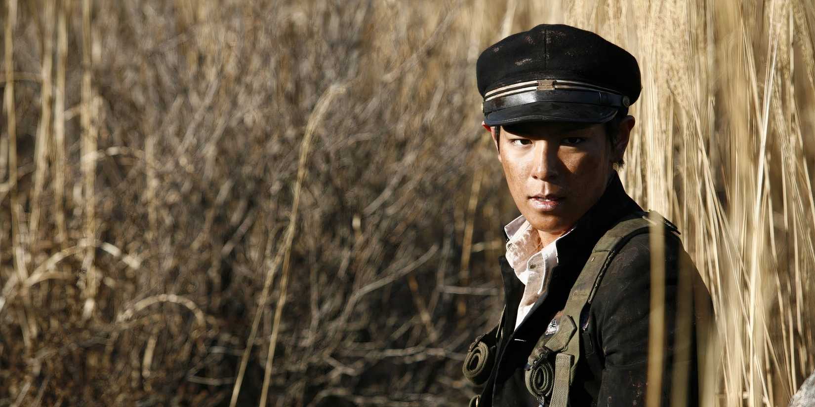 A Korean soldier in the grass in 71 Into The Fire