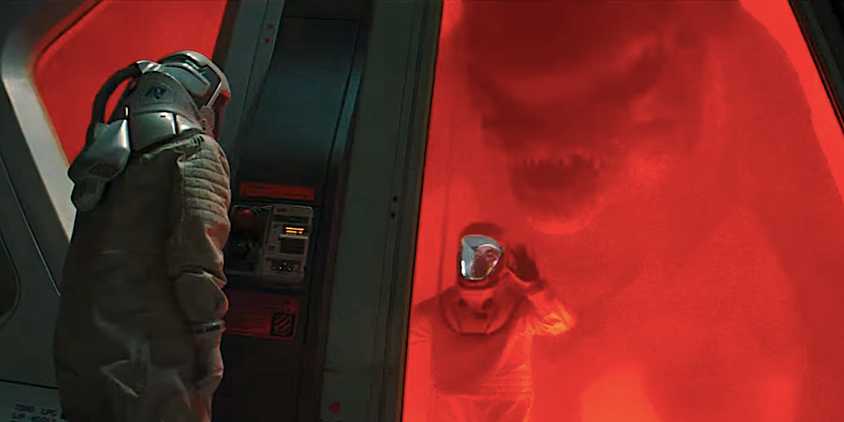 A massive dinosaur stands behind a man in a tank from Jurassic World Rebirth trailer-1