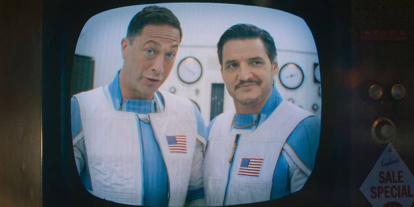 A television showing Ebon Moss-Bachrach's Ben Grimm and Pedro Pascal's Reed Richards in their spacesuits in the Fantastic Four First Steps (2025)