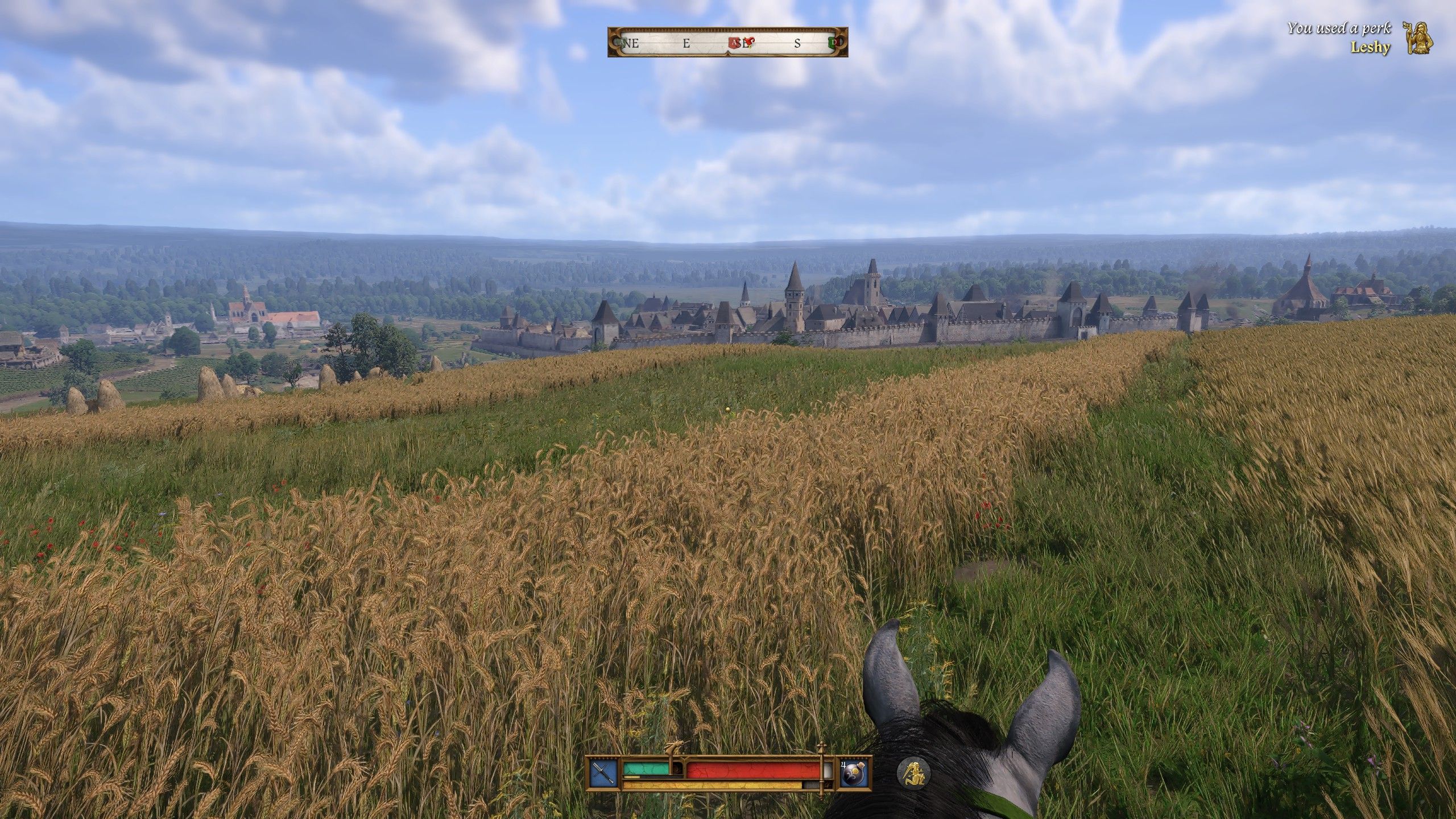 A view of Kuttenberg from horseback during the day in Kingdom Come Deliverance II