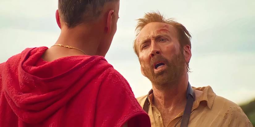 A haggard Nicolas Cage staring down an Australian surfer in The Surfer