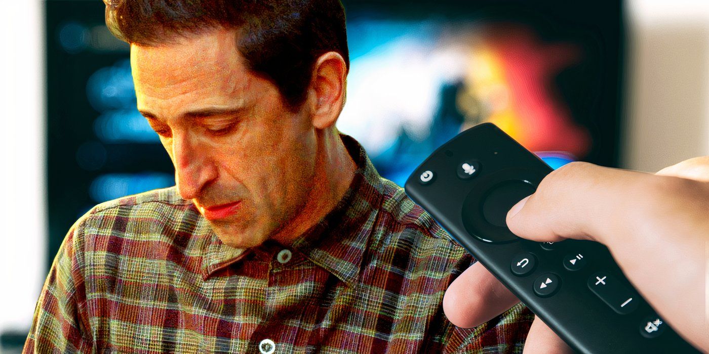 Adrien Brody from The Brutalist looking glum in front of a streaming TV