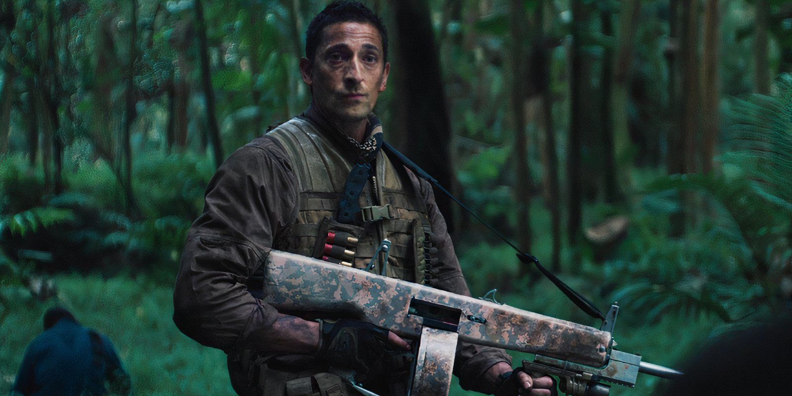 Adrien Brody holding a shotgun as Royce in Predators