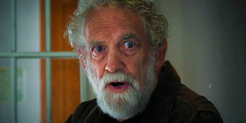 An old man looking scared in Clown in a Cornfield