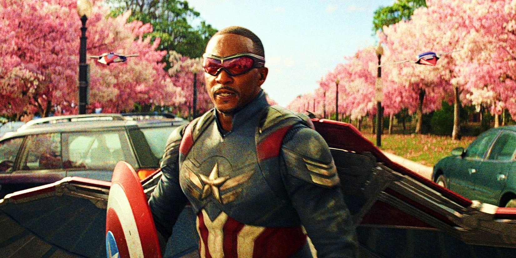 Anthony Mackie standing in front of cherry blossoms in Captain America Brave New World