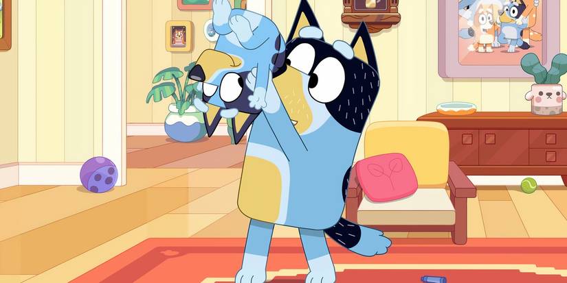 Bandit holding Bluey up and turning her upside down in a Bluey minisode