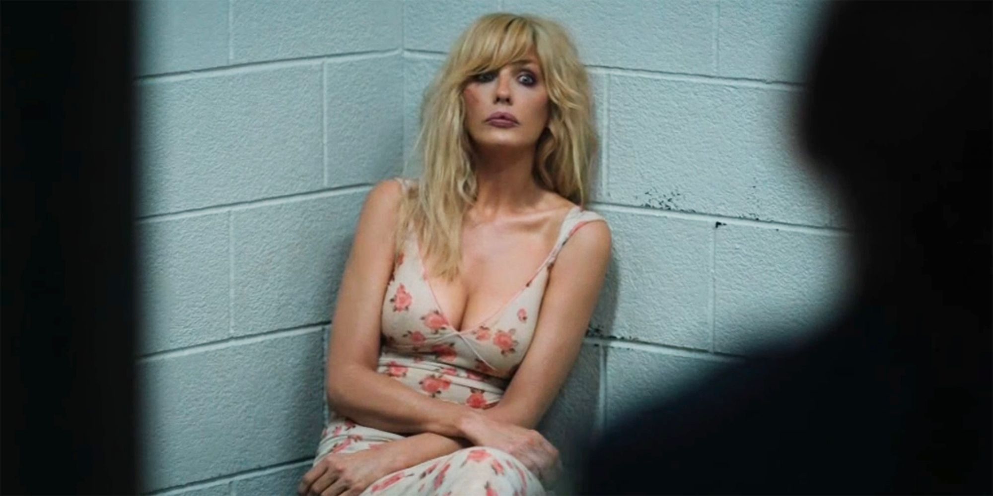 Beth Dutton looks surprised in a jail cell