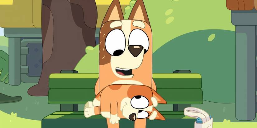 Bingo resting on Chilli's lap in a Bluey minisode