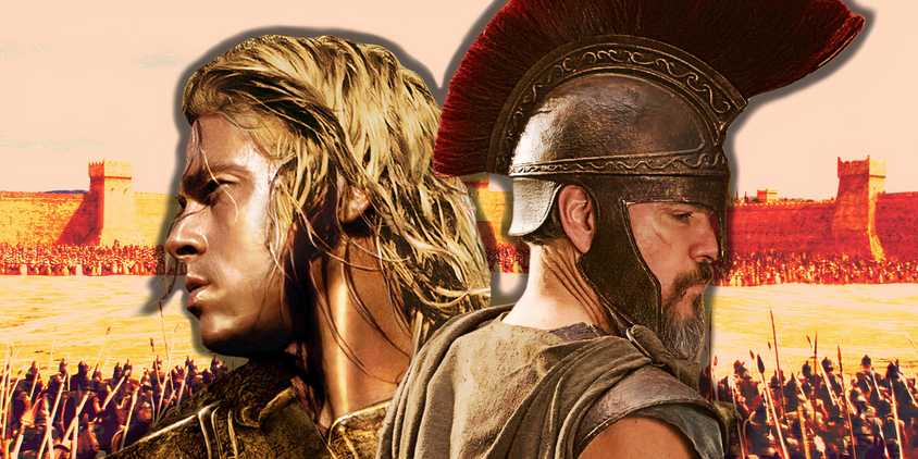 Brad Pitt's Achilles from Troy (2004) and Matt Damon's Odysseus from the Odyssey (2026) are in front of the city of Troy