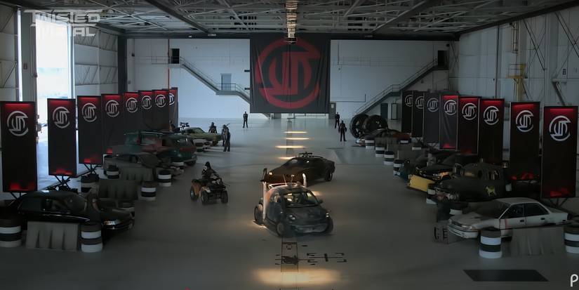 Cars are lined up in a warehouse in the Twisted Metal season 2 trailer
