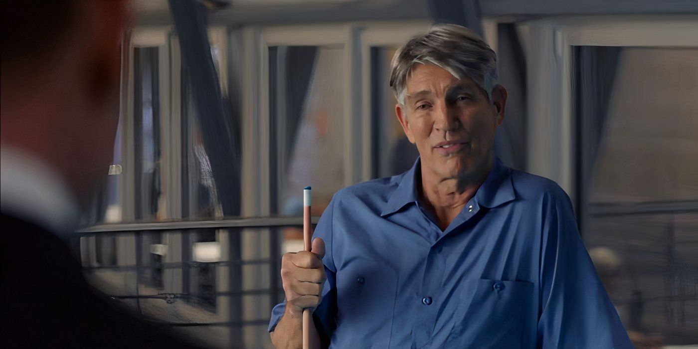 Charles Forstman (Eric Roberts) holding a pool cue in Suits