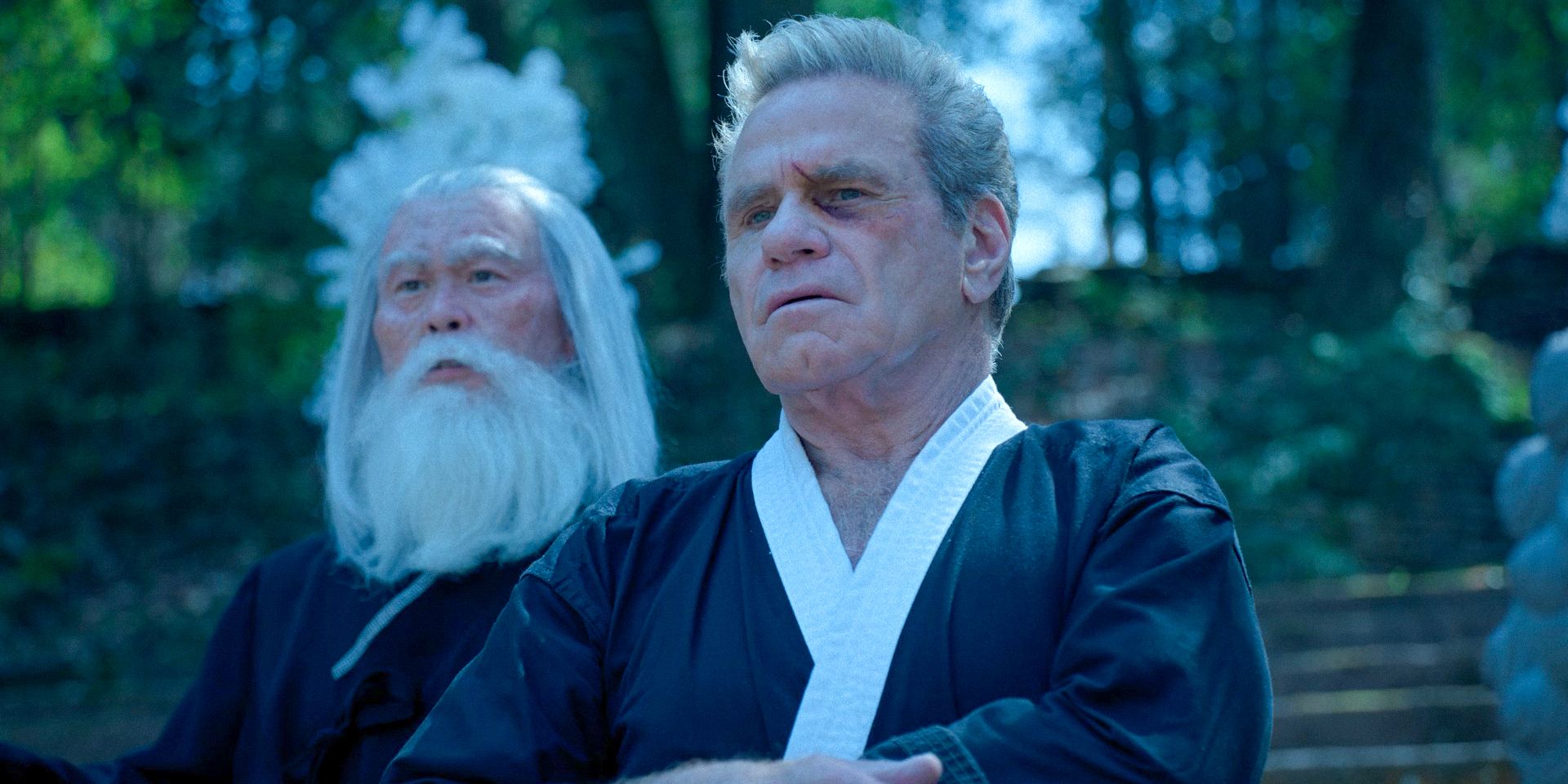 Master Kim (C.S. Lee) and John Kreese (Martin Kove) watch the Cobra Kai training in Cobra Kai Season 6 Ep 11