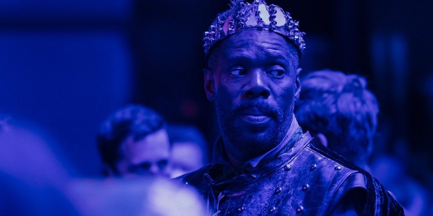 Colman Domingo in a king costume under a blue light in Sing Sing