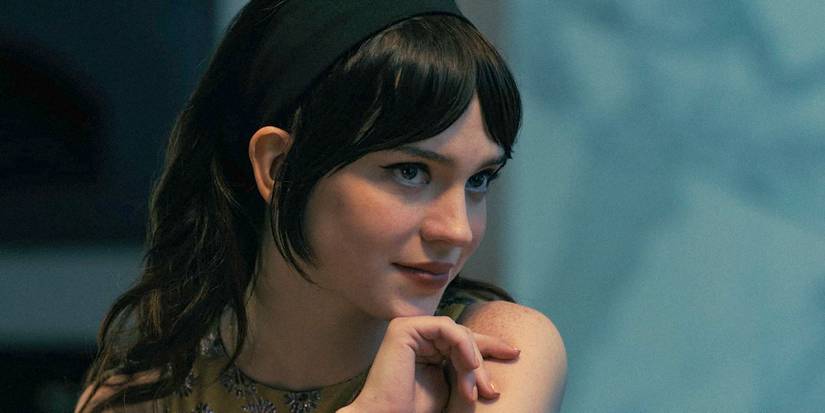 Sophie Thatcher as Iris looking curious in Companion